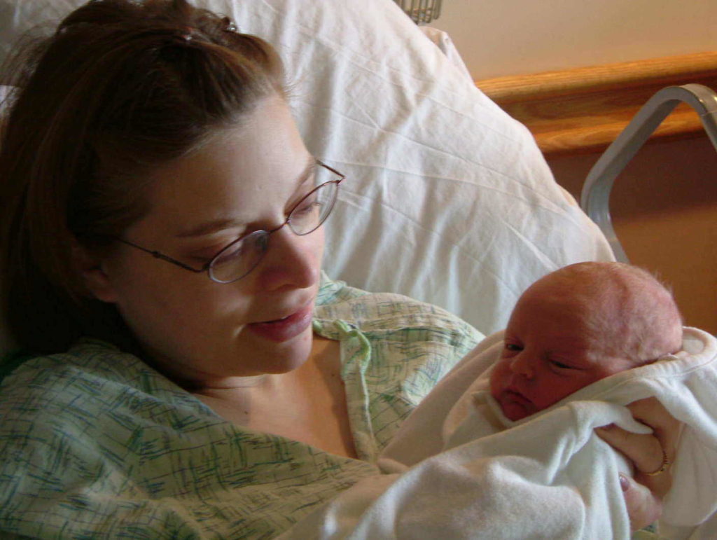 Susan looking at her newborn baby.